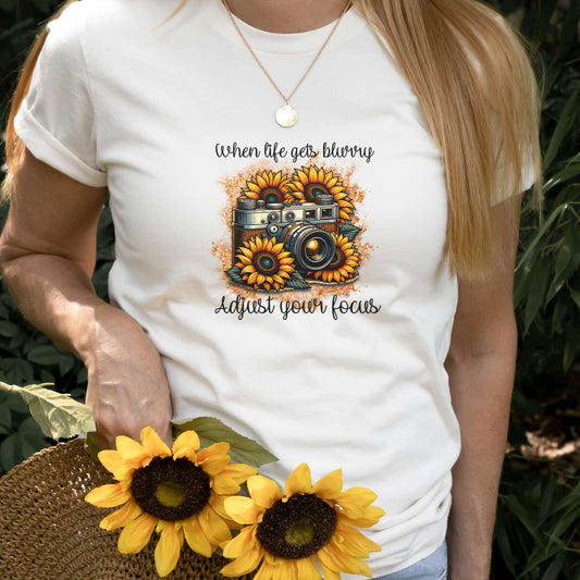 when life gets blurry adjust your focus, camera surrounded by sunflowers, womens tee, natural