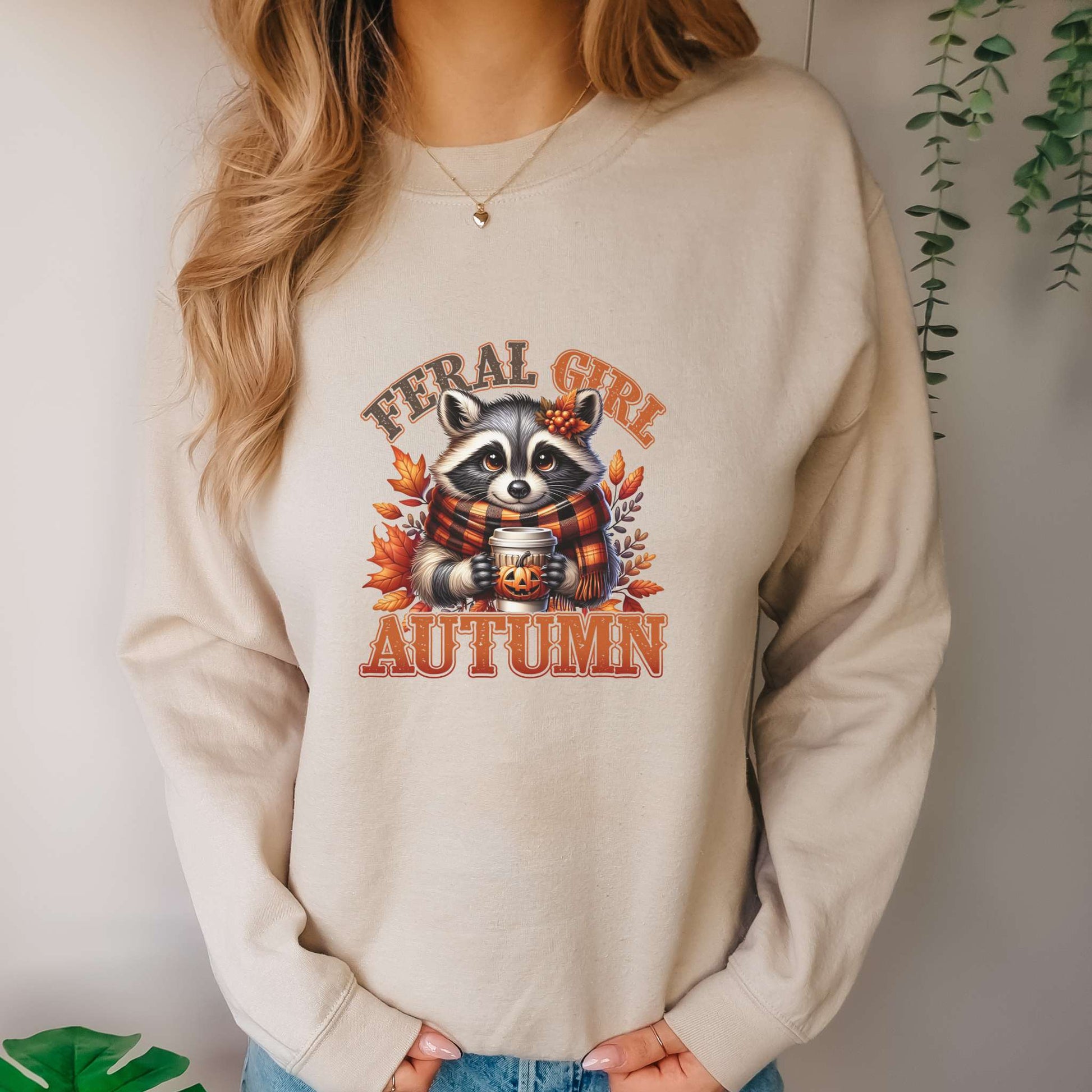 feral girl autumn, womens sweatshirt, adorable raccoon with scarf and fall foliage, sand